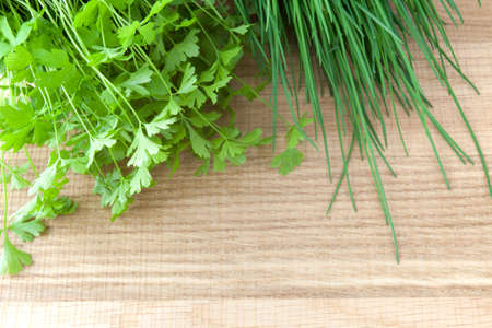 Parsley on a wooden tableの写真素材
