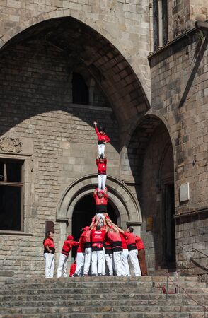 A group of people called castellers form a human pyramid in the streets of Barcelona. 03/18/2017 Barcelona, Spain.のeditorial素材