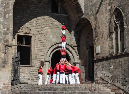 A group of people called castellers form a human pyramid in the streets of Barcelona. 03/18/2017 Barcelona, Spain.のeditorial素材