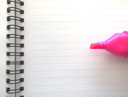 Open book and pink word Highlighter pen
