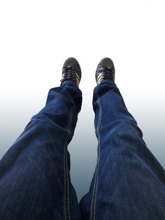 Stand by leg with jeans wear and sneakers.