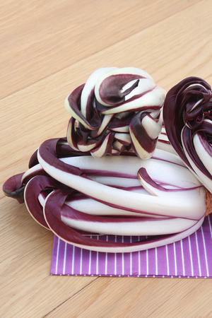 Red italian radicchio salad called on wooden tableの写真素材