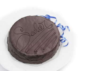 Sacher cake on a plate on white backgroundの写真素材