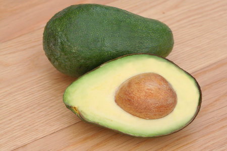 Fresh avocado on wooden table
