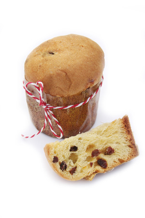 Italian Christmas cake called Panettone on white background. Traditional food to celebrate Christmas holidaysの写真素材