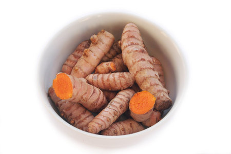 Close-up of Turmeric rhizome isolated on white background. Curcuma longa with selective focus