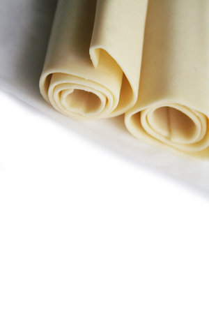 Puff pastry dough rolls isolated on white background