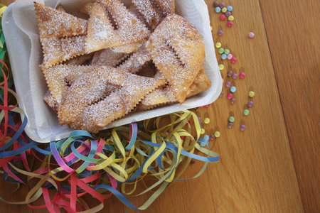 Italian carnival pastry on table. Traditional carnival pastry, chiacchere or crostoli, lies, cenci...