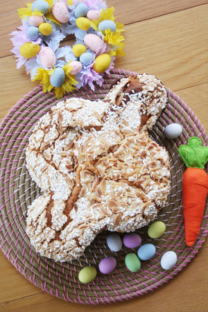 Sweet Easter cake called Colomba Pasquale with Easter eggs and colorful decoration. Italian pastry...
