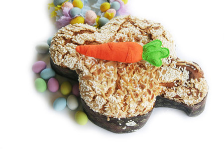 Sweet Easter cake called Colomba Pasquale with Easter eggs and colorful decoration. Italian pastry...
