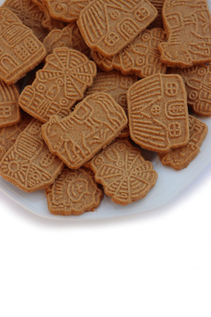 Traditional cookies from northern europe called Speculoos or Spekulatios isolated on white. Festive...