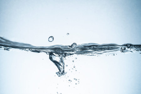 Water splash isolated. Close up of splash of water forming flower shape, isolated on white...