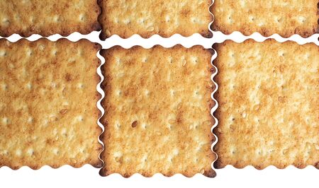 Macro photo of brown dietary low-calorie crispy cereal cracker with sesame dressing close-up on a white backgroundの写真素材