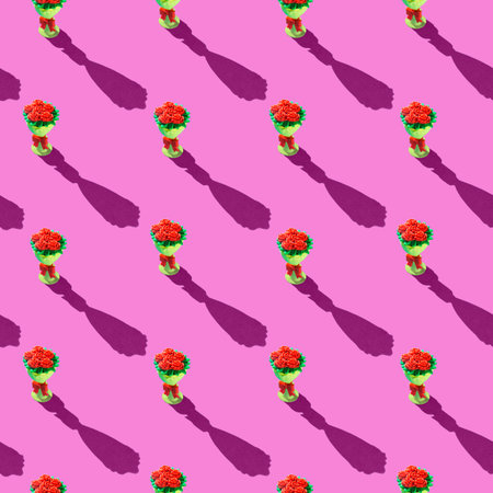 Photo seamless pattern red flowers in a yellow bouquet are arranged vertically with shadows on a...