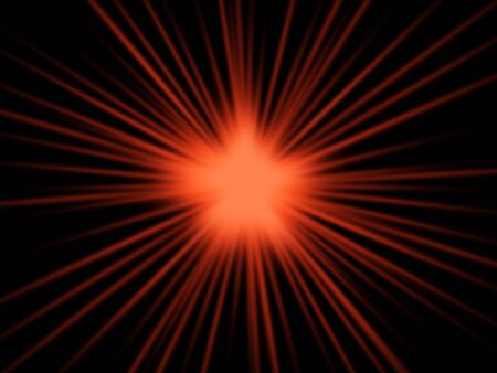 Red starburst on black backgroundの写真素材