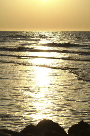 Golden sunset over the oceanの写真素材