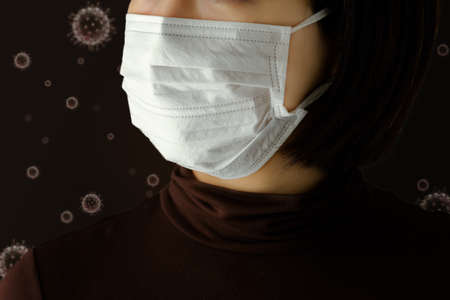 A woman wearing a mask to prevent infectionの写真素材