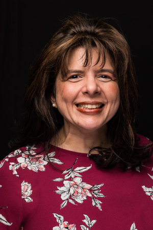 Middle aged brunette business women headshot.