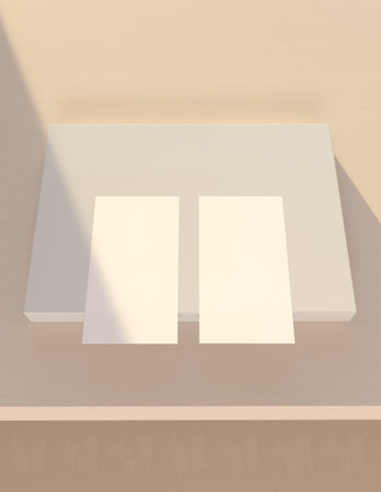 Design concept - top view of two white business cards leaning on beige wall in officeの写真素材