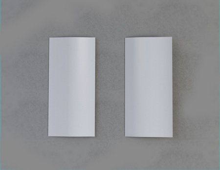 Showcase your content with this 3D illustration of a blank brochure mock-up, featuring a simple and harmonious background. Roll-Fold 297mm 210mm size.の写真素材