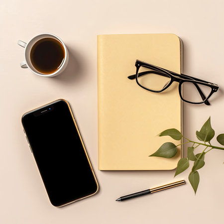 Flat lay, top view office desk workspace. Notebook, coffee cup, smartphone and glasses.の素材