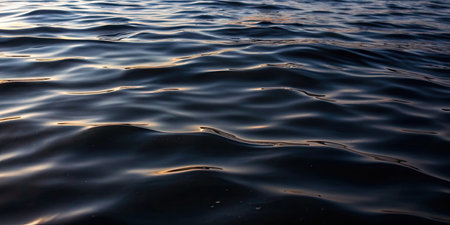 Blue water surface texture background. Close up of rippled water surface.の素材
