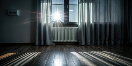 Sunlight through the window in a room with a wooden floor.の素材