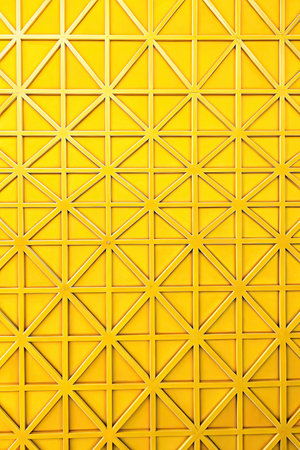 Bright yellow geometric pattern with triangular shapes.の素材