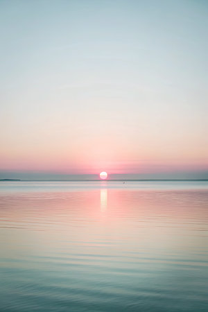 Peaceful sunset over the vast calm sea.の素材
