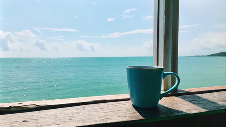 Seaside View from Wooden Deck with Blue Coffee Cupの素材