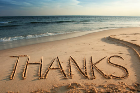 Thank-You Message Written in Sand on Serene Beach with Ocean Wavesの素材