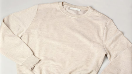 Plain Beige Sweatshirt on a Neutral Backgroundの素材