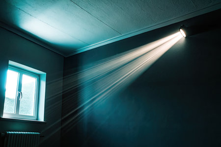 Light from the window on the wall of the room in the darkの素材