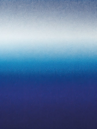 blue background with some reflected light on it and some spots on itの素材