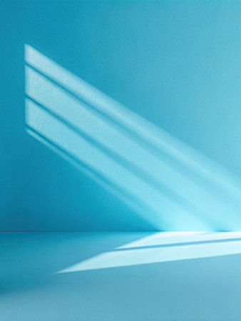 Blue wall with sunlight and shadow. Abstract background.の素材