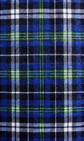 Blue and black tartan fabric texture useful as a background or wallpaperの素材