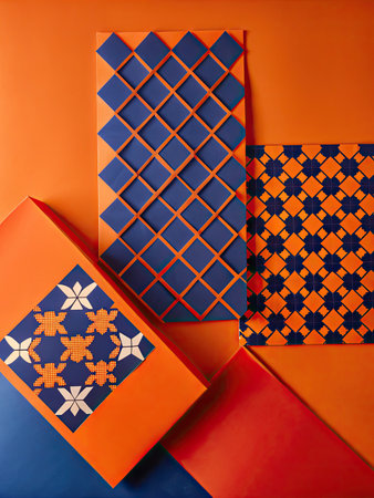 Colorful patterned gift boxes on orange background. Top view.の素材