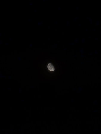 The moon in the night sky, closeup of a lunar eclipseの写真素材