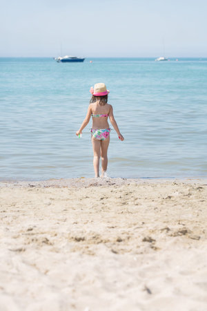 Girl Goes to the sea to play in the water, see.の写真素材