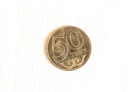 Kazakhstan coin on white wood background.Currency of Kazakhstan