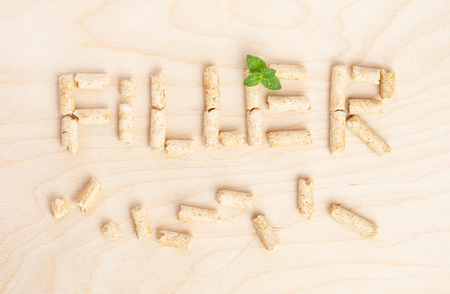 Text Filler made of filler for toilets of cats. Top view.List of mintの写真素材
