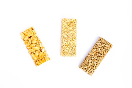 Granola bar. Healthy sweet dessert snack. Sesame, hazelnut, sunflower in honey. Gozinaki is Georgian national food, oriental sweet. Top viewの写真素材