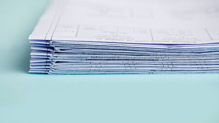 Stack Folding drawings on a blue background. Copy space.の写真素材