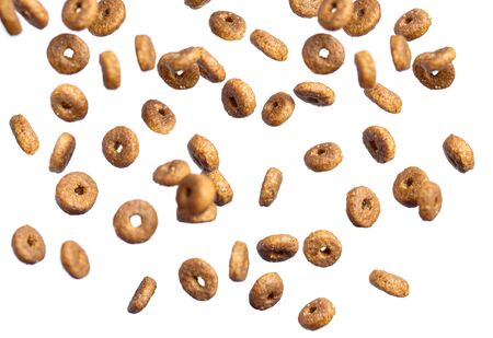 Dry cat food poured in different directions on a white background. flying.の写真素材