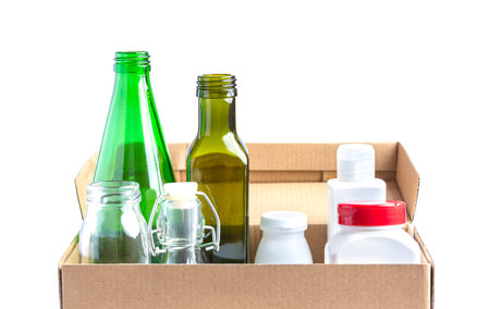 Glass garbage, plastic, aluminium in a box on white.