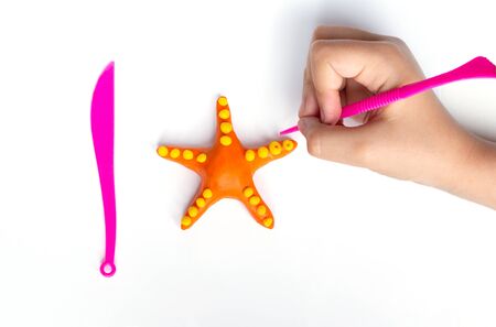 Plasticine modeling starfish. Sea background. Step by step 7.の写真素材