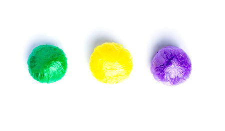 Balls from Multi-colored disposable plastic bags on white background