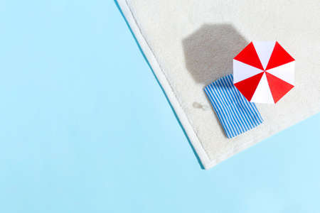 Summer beach scene, sun loungers, umbrella, sea, shadows. Minimalism concept. Relaxation and tranquility. Top viewの写真素材