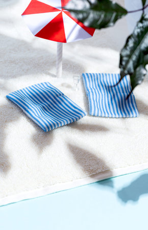 Summer beach scene, sun loungers, umbrella, tree branches, shadows. Minimalism concept. Relaxation...