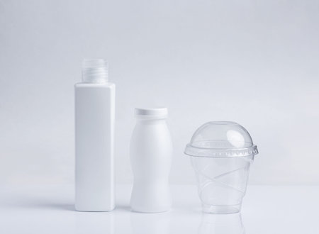 White plastic jars, glass, packaging. Garbage, environmental problems